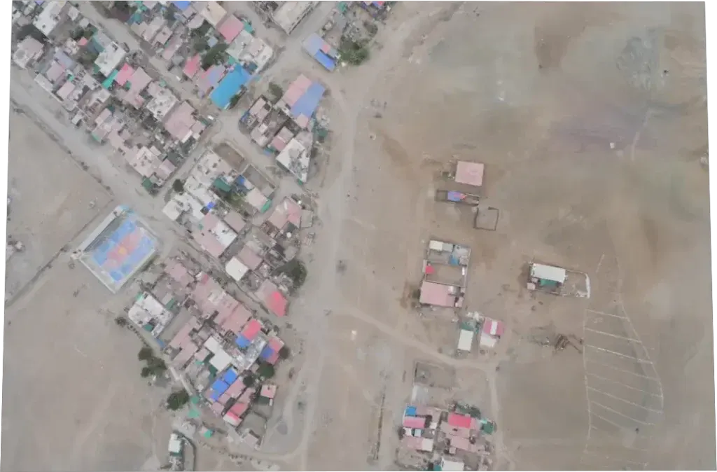 Rectified aerial photo of an area with houses, crops and a road