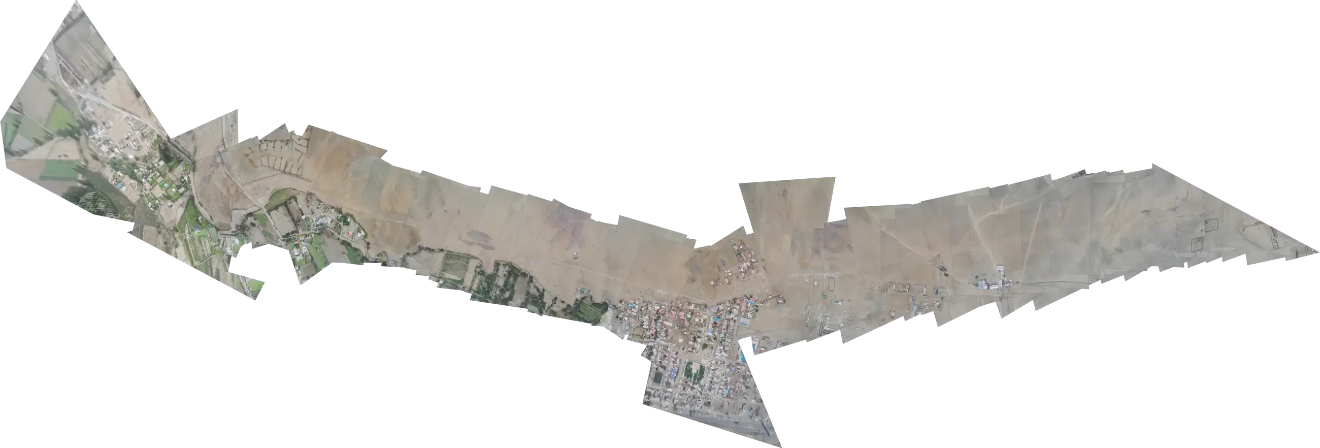 Mosaic of aerial photos from one flight, stitched over the ground, emerging from the dark under the light